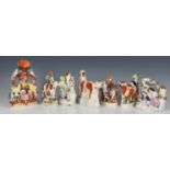 A collection of Staffordshire Spill Vases, one in the form of a horse and cow drinking from a