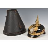 A First World War style German /Prussian pickelhaube with iron cross and applied badge, leather