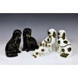 A group of five 19th century Staffordshire dogs, comprising a pair in black glaze with gilt