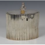 A George III silver tea caddy, Robert Hennell I, London 1784, of reeded, oval form, the hinged lid