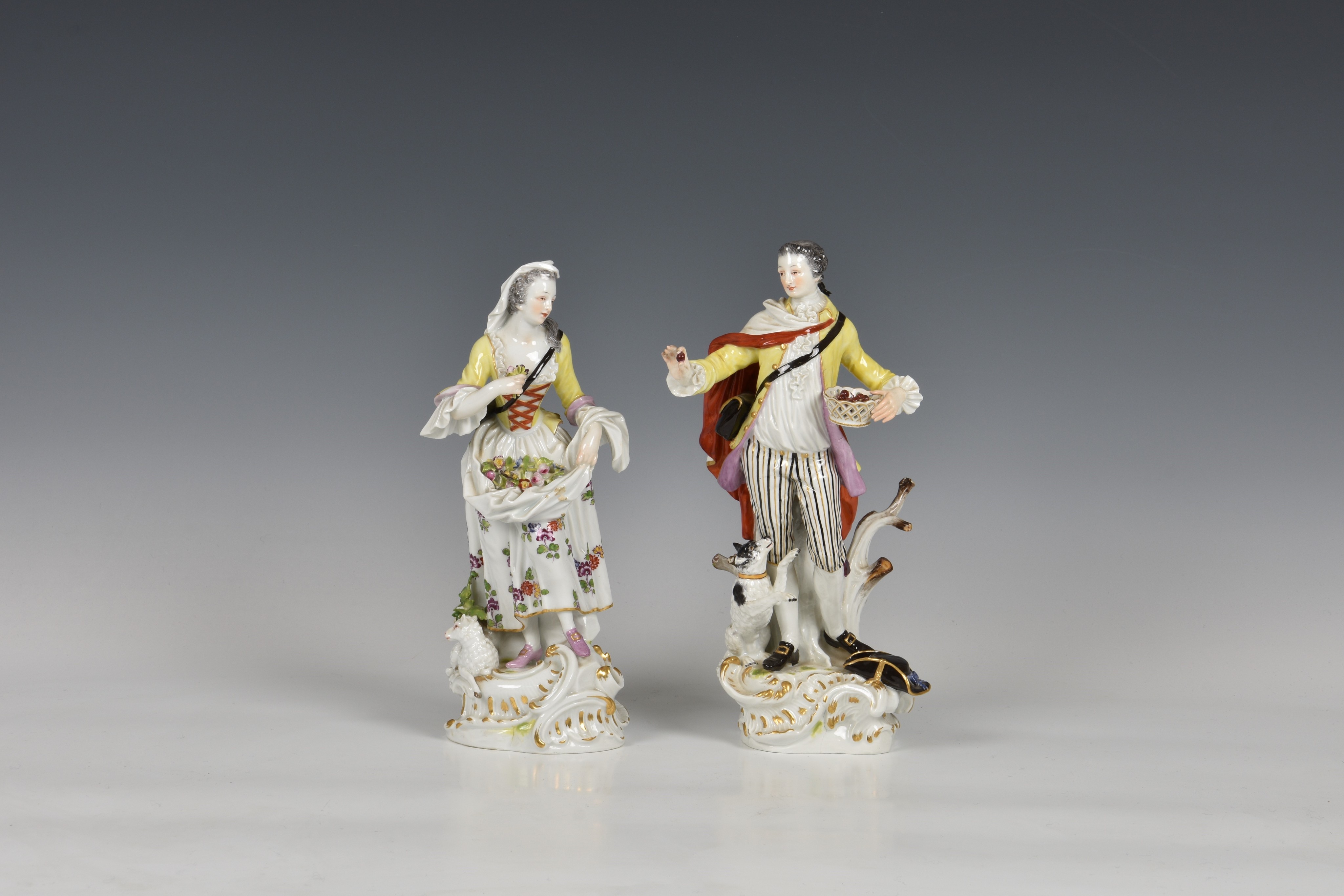 A pair of Meissen figures of a gallant and his companion, early 20th century, the man holding a