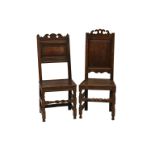 Two 17th century oak chairs, one having twin finials with a fielded panel below, turned legs and