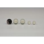 Four rare sulphide glass marbles, two large containing different breads of dogs, 35mm and two