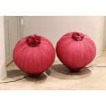 A pair of pink silk 'pomegranate' floor or table lamps, 22in. (56cm.) high, some fading to silk. (2)