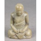 A carved hard stone figure of Buddha, 5in. (12.7cm.) high. * Condition: Natural flaws, surface marks