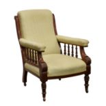 A Victorian mahogany armchair, with spindle arms.