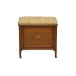 An Edwardian mahogany piano stool, the stuff over seat lifting to a three compartment interior for