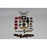 Twelve fabric military badges, with military cap badges / shoulder titles and military buttons