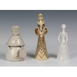 Three mid 20th century comical figures by Marion Morris, the tall female figure in a sand glaze,