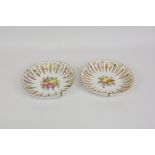 Two Meissen fruit decorated shallow bowls with multi lobed, fluted sides, alternate flutes with