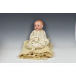 An Armand Marseille bisque head baby doll impressed '518 / 61/2 K', with painted moulded hair,