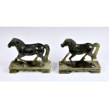 A near pair of carved green soapstone horses 20th century, raised on rectangular plinths, 6 ½in. (