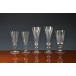 A pair of Georgian etched ale glassesthe trumpet bowls etched with hops and barley, on an