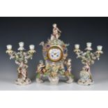A Meissen style mantel clock garniture the clock with applied putti and flowers, 19in. (48.2cm.)