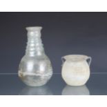 A Roman style glass vase probably 20th century, pale blue glass with surface iridescence, the