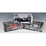 Three boxed 1:18 scale die-cast racing cars to include Hot Wheels J2979 Williams FW28 F1 Racing