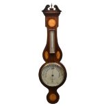 An Edwardian mahogany 'banjo' aneroid barometer in the Sheraton style with satinwood shell and fan