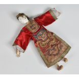An early 20th century Chinese opera doll with detachable painted composition head with elaborate