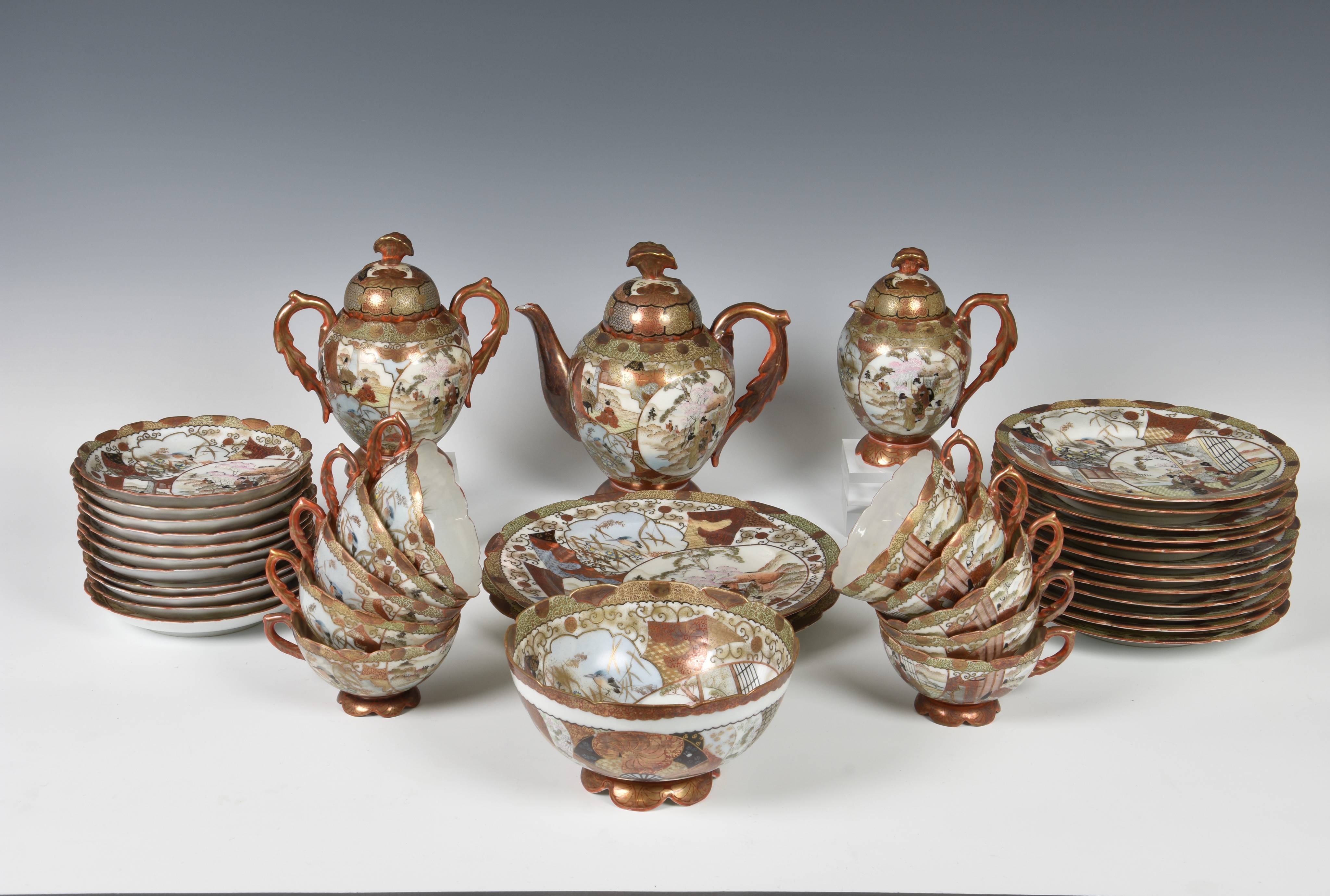 A Japanese Satsuma porcelain part tea service early 20th century, comprising a teapot, cream jug,