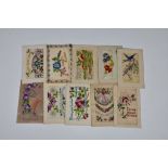A large collection of vintage & antique silk postcards to include military. (quantity)