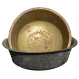 Two large Guernsey brass bachin both with decorated rim, the larger 28¾in. (73cm.) diameter, the