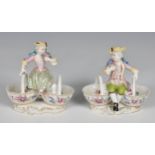 A pair of Meissen style porcelain figural salts 20th century, in the form of a boy and girl, in 18th