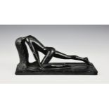 An Art Deco style sculpture of a female nude with long flowing hairblack painted plaster,