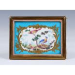 A small Sevres style porcelain plaque 19th century, painted with a mirror shaped reserve with