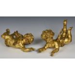 A mirrored pair of carved giltwood winged cherubs 20th century, re-gilded, 14½in. to 15in. long. (2)