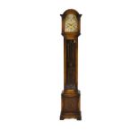 An oak Tempus Fugit grandmother clock the silver chapter ring with Roman numerals and additional