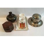 A collection of vintage and antique inkwellscomprising a Guernsey crested ware inkwell, of sledge