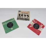 Two Beatles Seven inch single vinyl records including ‘Twist and Shout’ and ‘She Loves You’ along