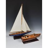 Two wooden model boats late 20th century, comprising a mid-century style speedboat, 19½in. (49.5cm.)