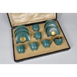 A Royal Worcester porcelain cased demitasse set decorated with a textured shagreen effect finish,