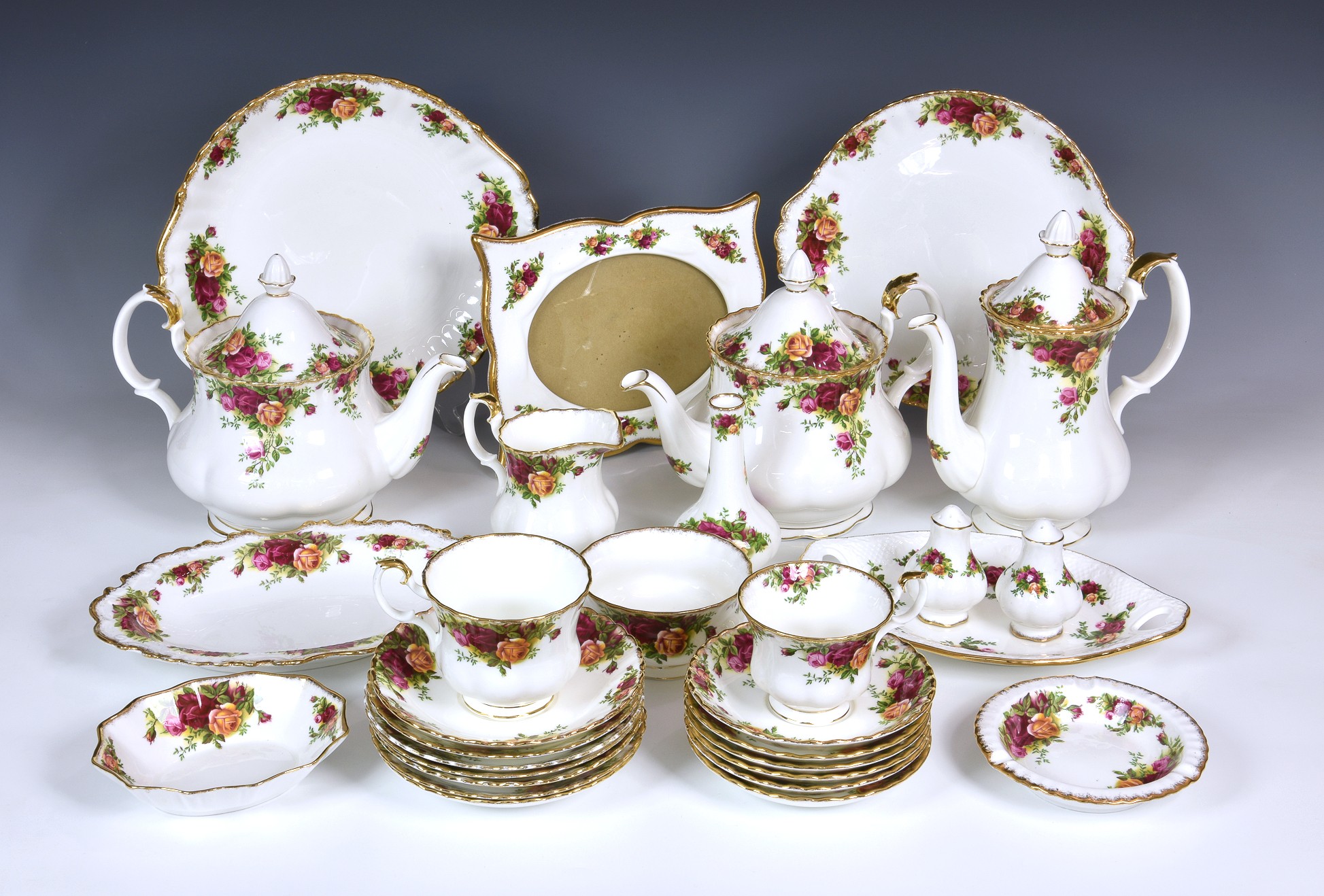 A Royal Albert Old Country Roses tea and coffee servicecomprising two large teapots, a coffee pot,