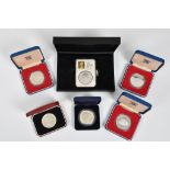 Numismatics interest - A collection of cased commemorative coinage to include Guernsey 2000 silver