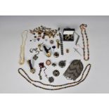 A collection of various costume jewellery etc to include two Scottish hardstone brooches; military