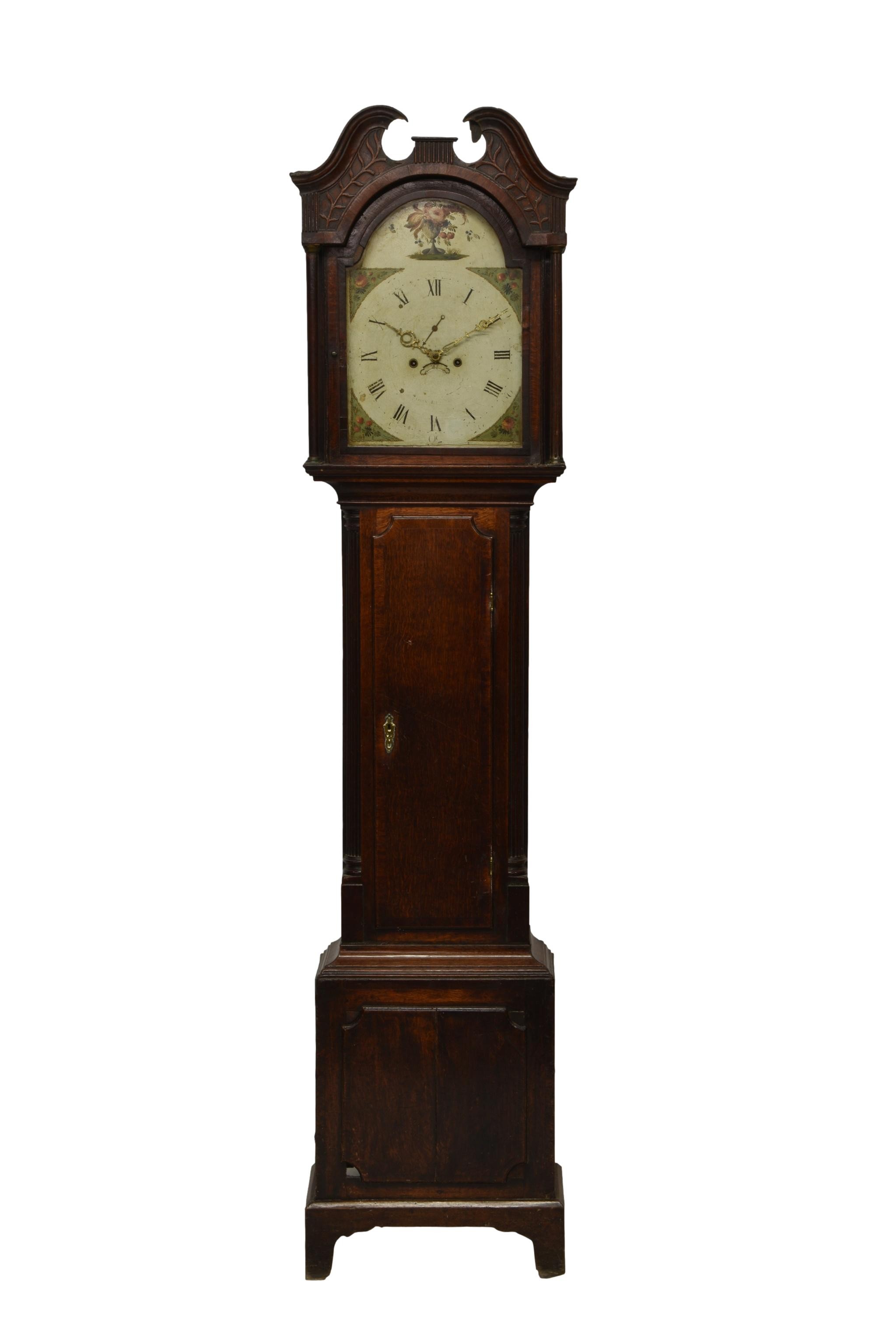 A late 18th century oak eight day longcase clock the bell strike movement fronted by a painted Roman
