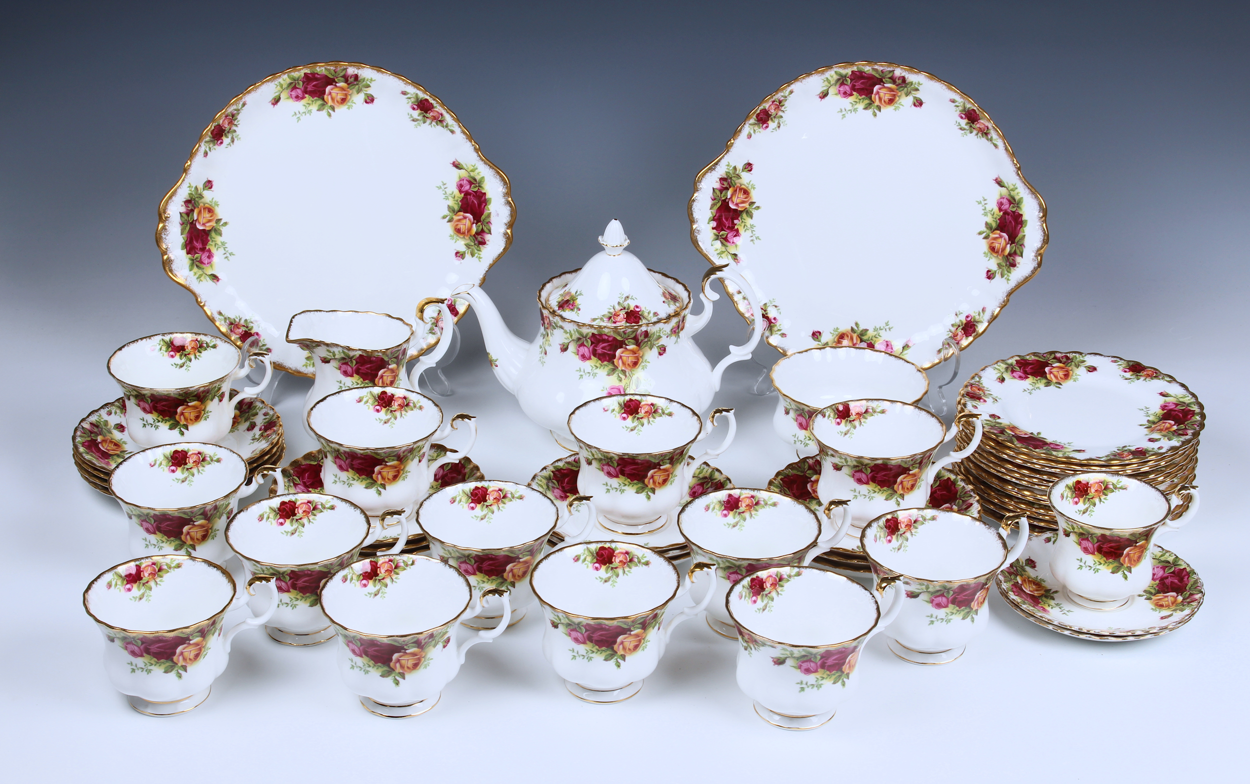 A Royal Albert Old Country Roses bone china tea service comprising a teapot, cream jug, sugar