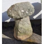 A Guernsey granite mushroom the base approximately 18 inches in height, plus cap of approximately 15