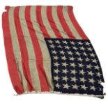 A WWII era 48 star cotton American flag wooden toggle, approximately 49 x 72in. (124.5 x 182.