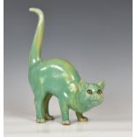 A mid-century glazed stoneware figure of a startled cat the well modelled figure with inset glass