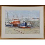 Two Guernsey boat scenes by P Wilkinson to include a watercolour of fishing boats, dry docked at