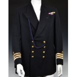 A Royal Navy Uniform Jacket having mounted medal ribbons, bullion wire cuff braid for the rank of
