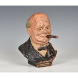 A mid 20th Century terracotta striker / table lighter in the form of Winston Churchill with his