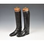 A pair of black leather riding boots with wooden stretchers c.1930, unmarked , reportedly by Henry