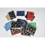 Numismatics interest - A collection of various mint uncirculated coin cases to include, 'The Coinage