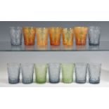 A matched set of fourteen French moulded, coloured glass water glasses comprising five in burnt