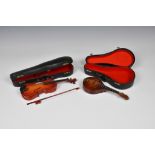 Miniature cased mandolin and violin the largest measuring 9½in. (24.2cm.). (2)