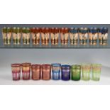 A mixed group of mid-century coloured glass and gilt tumblers including a set of eleven gilt glitter